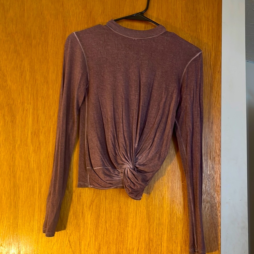 This is a purple long sleeve top. Light material and perfect for any weather.